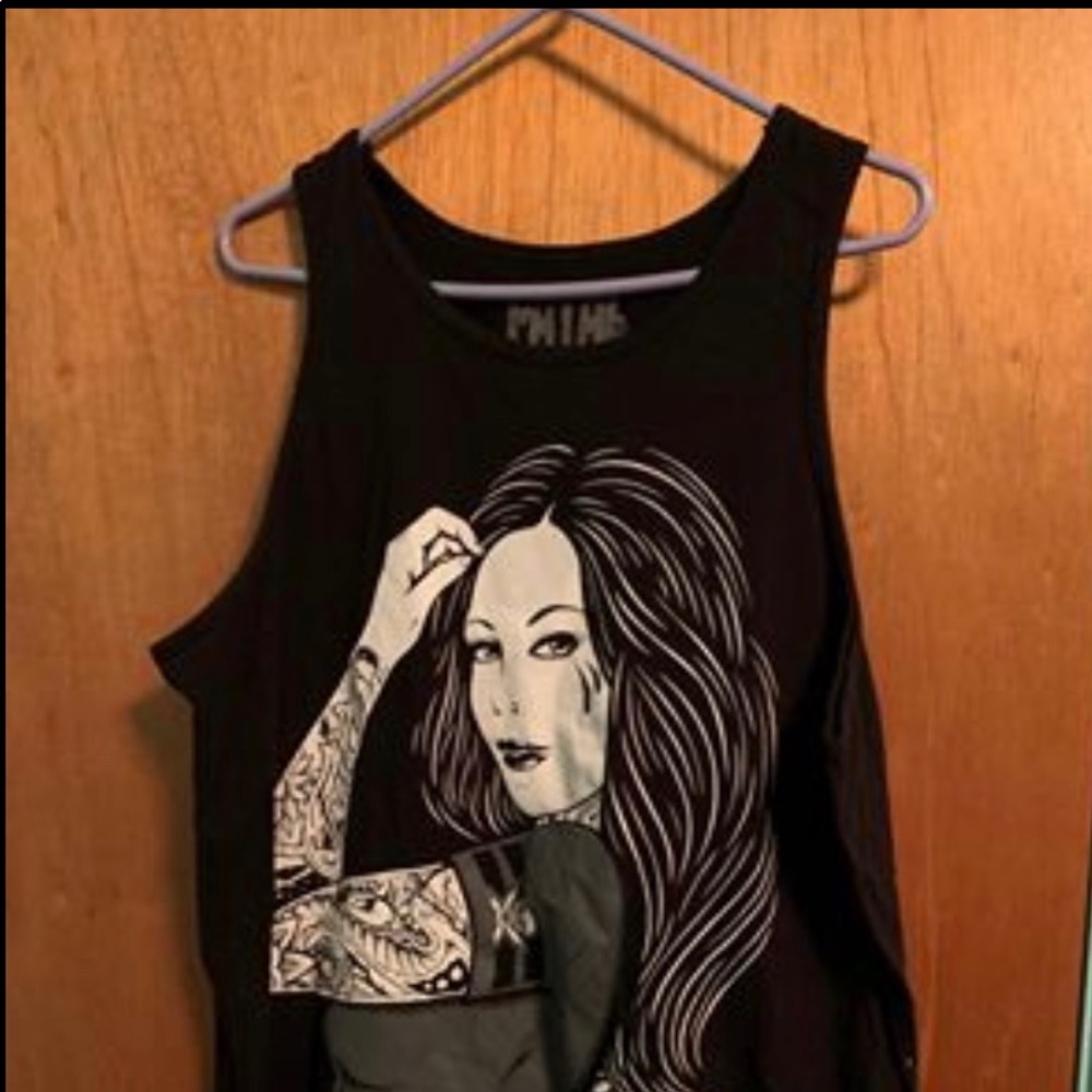 Four men’s Large muscle Tank Top Shirts